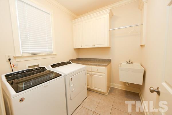 4740 Sandy Bay Circle Raleigh, NC 27603 - Photo 11 of 24 a utility room with dryer and washer