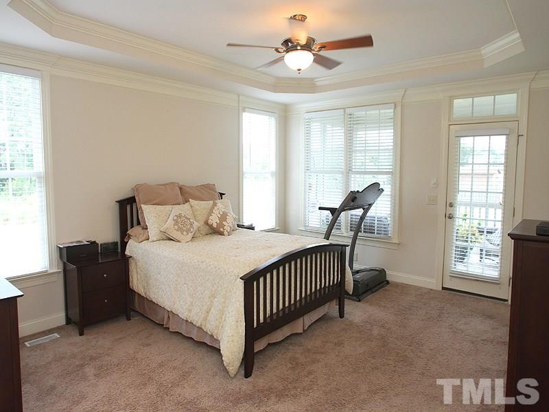 4740 Sandy Bay Circle Raleigh, NC 27603 - Photo 12 of 24 a bedroom with a bed and a window