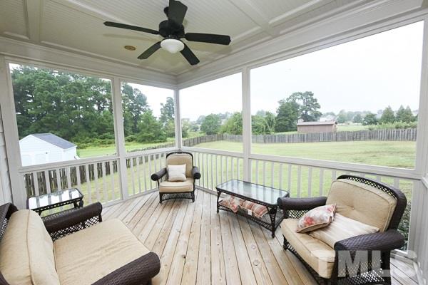 4740 Sandy Bay Circle Raleigh, NC 27603 - Photo 20 of 24 a view of a chair in wooden deck