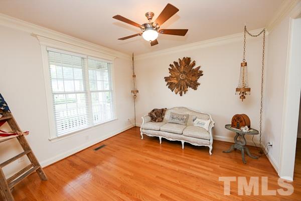 4740 Sandy Bay Circle Raleigh, NC 27603 - Photo 2 of 24 a living room with furniture and a rug