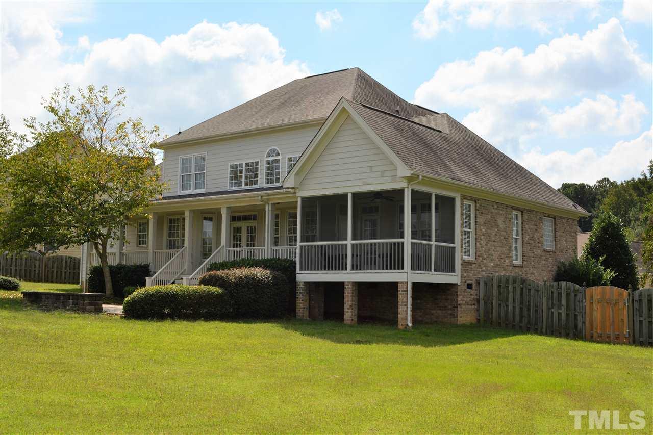 4740 Sandy Bay Circle Raleigh, NC 27603 - Photo 23 of 24 a front view of a house with a garden