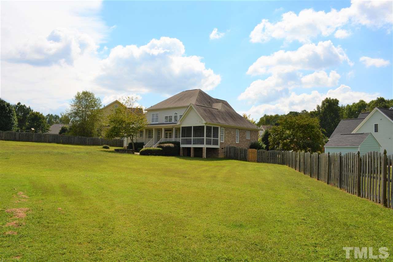 4740 Sandy Bay Circle Raleigh, NC 27603 - Photo 24 of 24 a front view of a house with a garden