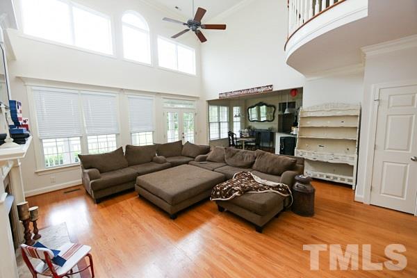 4740 Sandy Bay Circle Raleigh, NC 27603 - Photo 4 of 24 a living room with furniture window and wooden floor