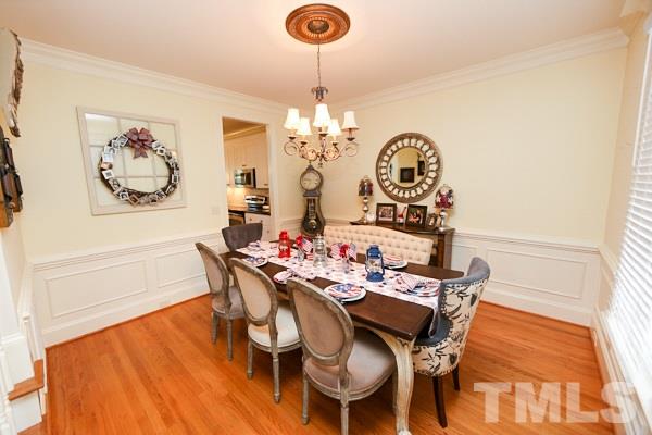 4740 Sandy Bay Circle Raleigh, NC 27603 - Photo 10 of 24 a view of a dining room with furniture and chandelier