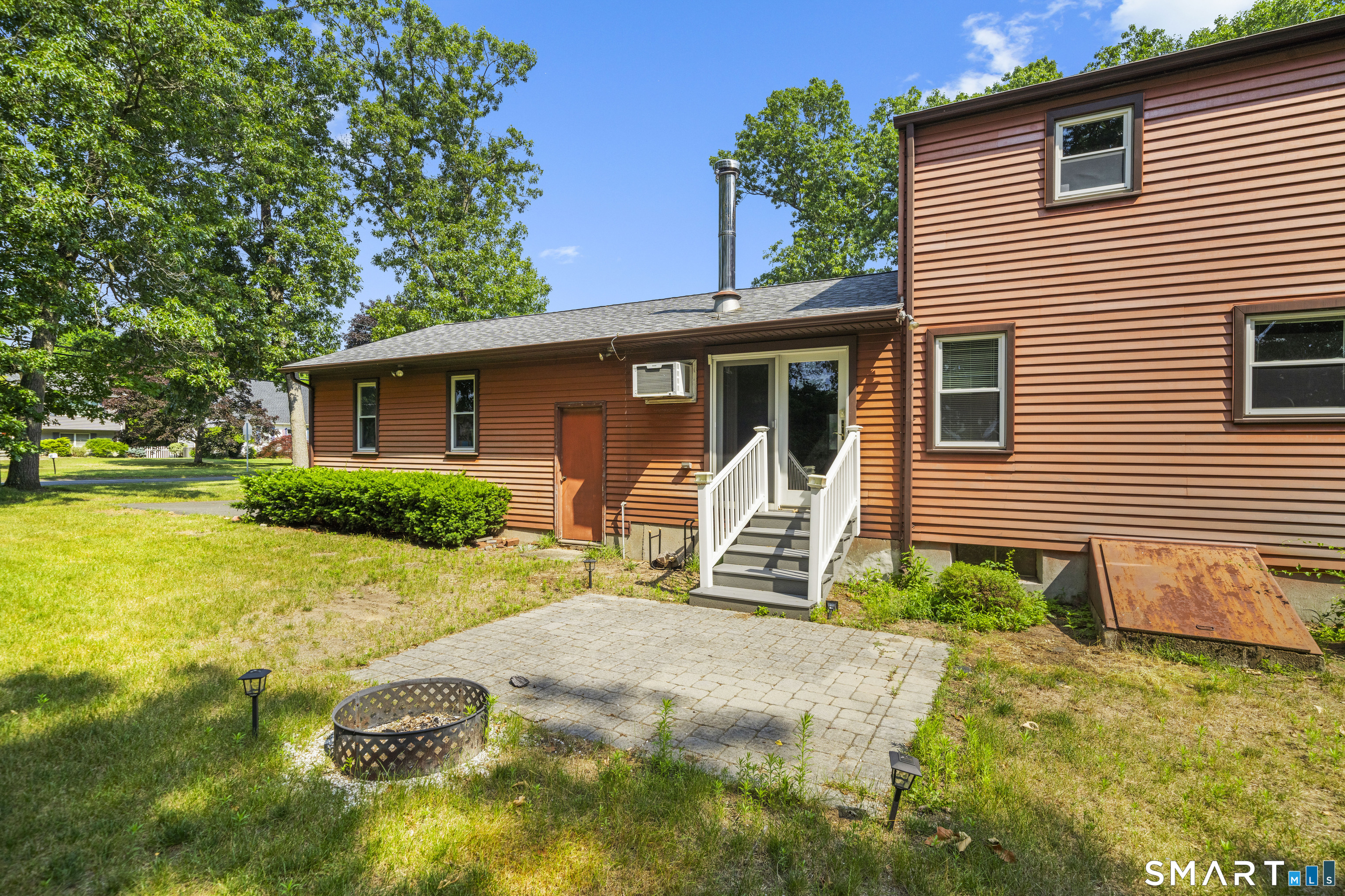 2 Sparkle Street Enfield, CT 06082 - Photo 31 of 32 Step out from the first floor family room onto a paver patio