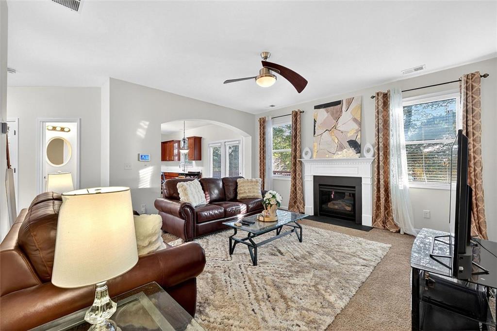 2517 Kolb Manor Circle Southwest Marietta, GA 30008 - Photo 12 of 33 a living room with furniture and a fireplace