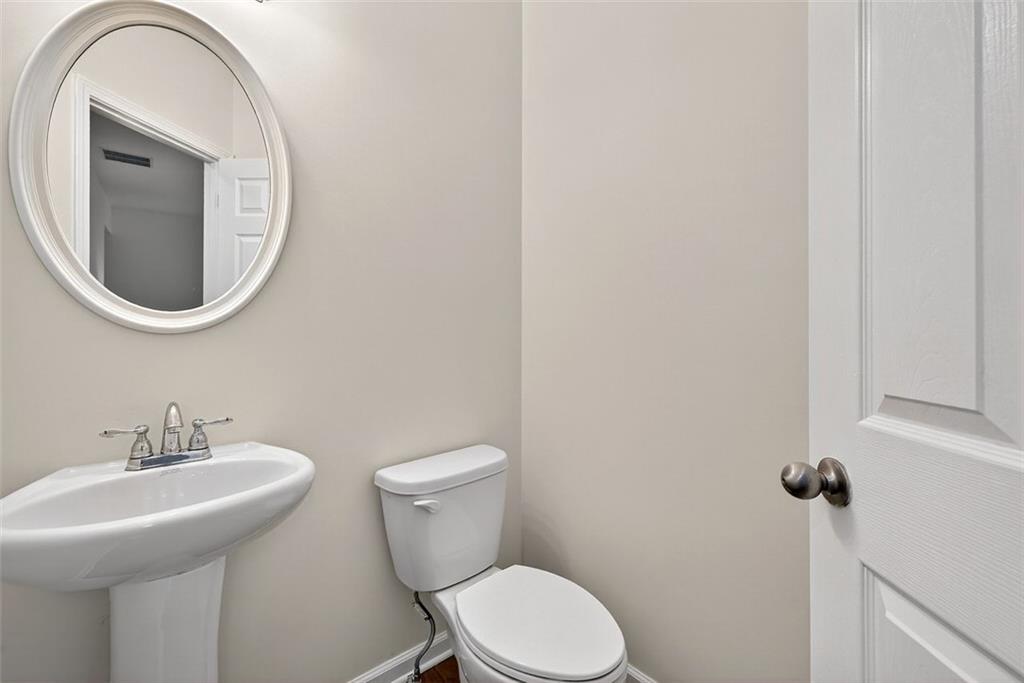 2517 Kolb Manor Circle Southwest Marietta, GA 30008 - Photo 13 of 33 a bathroom with a toilet and a sink