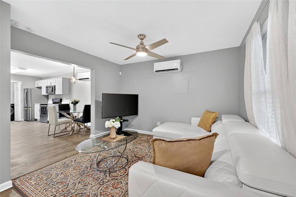 2517 Kolb Manor Circle Southwest Marietta, GA 30008 - Photo 26 of 33 a living room with furniture and a flat screen tv