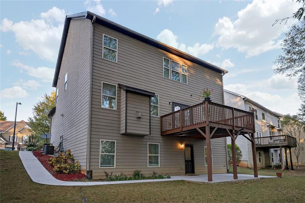 2517 Kolb Manor Circle Southwest Marietta, GA 30008 - Photo 30 of 33 a front view of a house with a yard