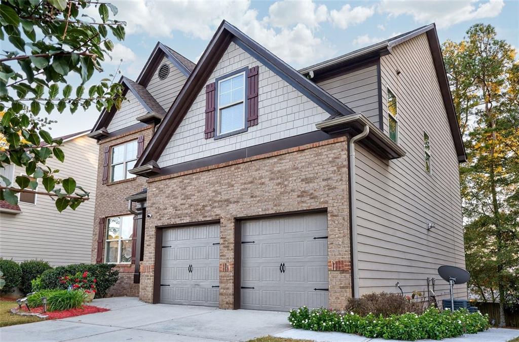 2517 Kolb Manor Circle Southwest Marietta, GA 30008 - Photo 3 of 33 a front view of a house with garage