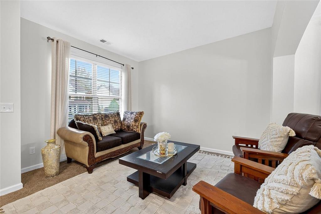 2517 Kolb Manor Circle Southwest Marietta, GA 30008 - Photo 5 of 33 a living room with furniture and a window