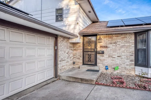 a view of a brick house with windows