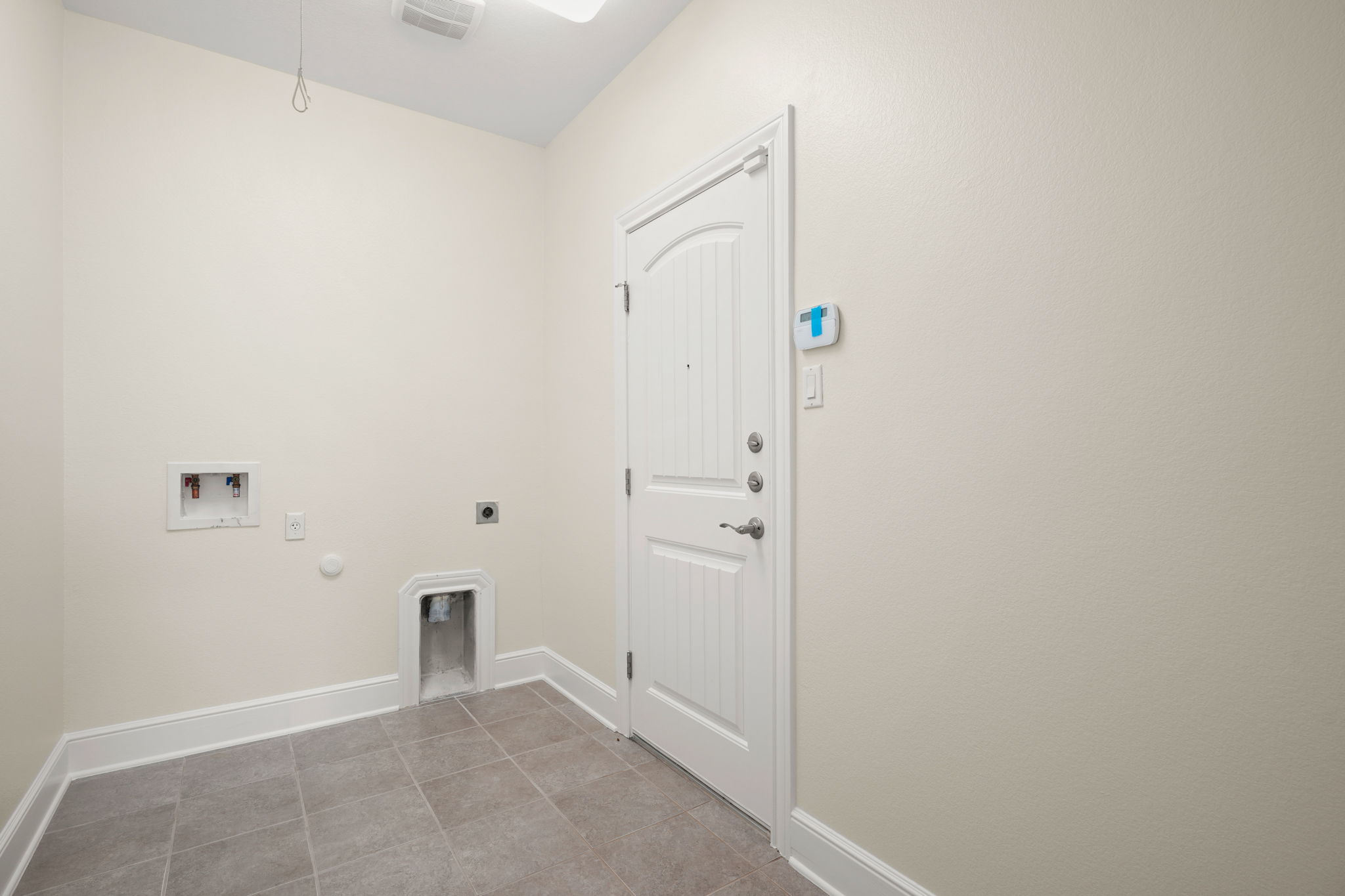 440 Cherokee Rose Circle Georgetown, TX 78626 - Photo 30 of 39 A dedicated laundry space provides practical utility and access to the home.