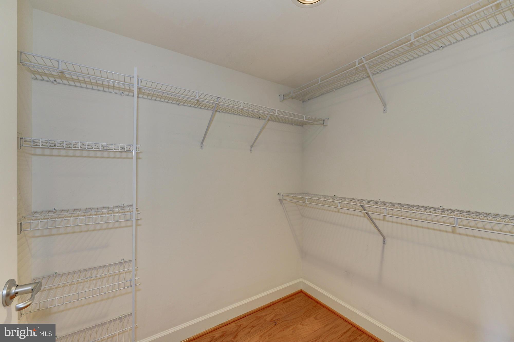11800 Sunset Hills Road, Unit 517 Reston, VA 20190 - Photo 12 of 29 a view of a room with racks on the wall