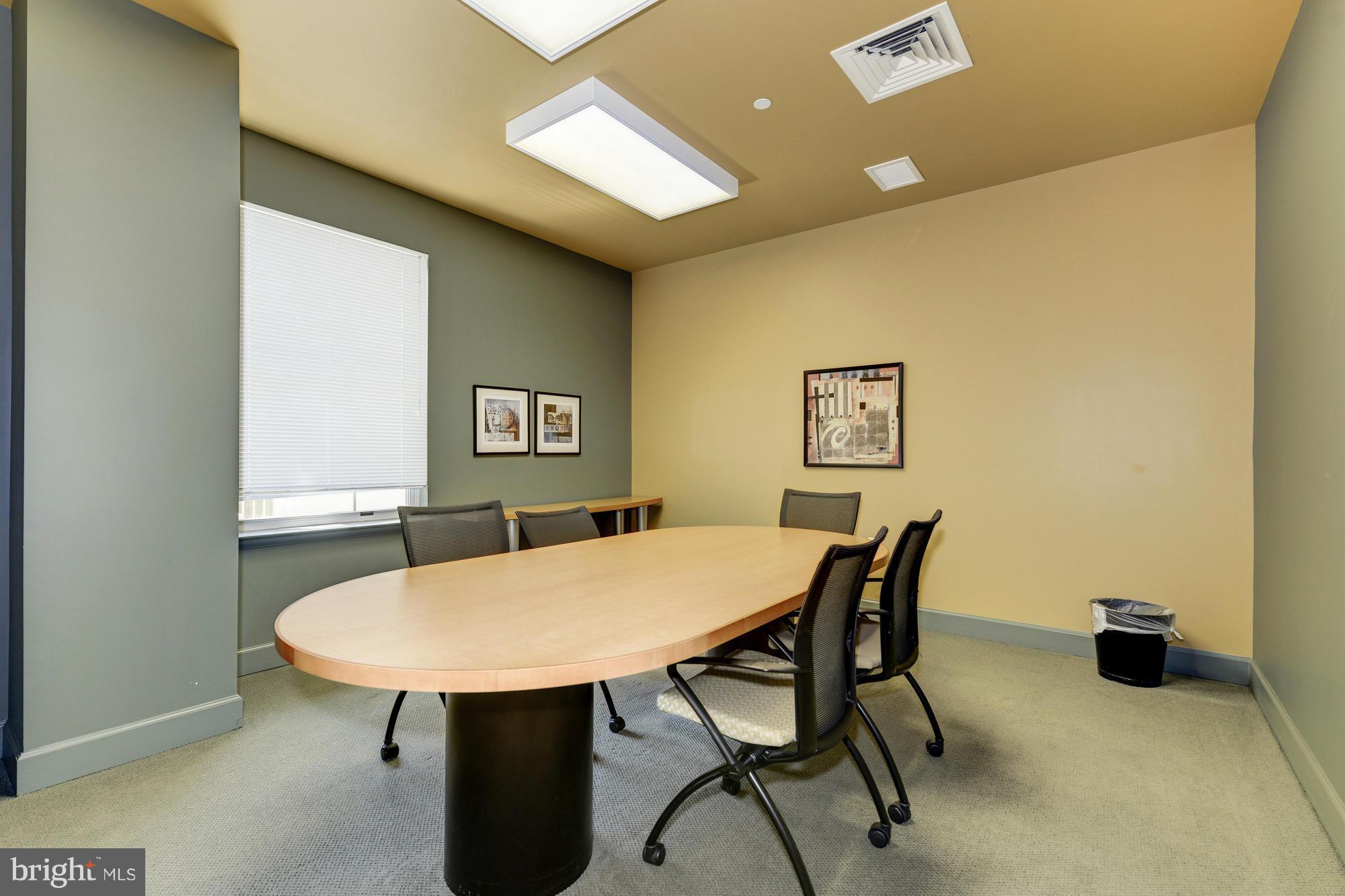 11800 Sunset Hills Road, Unit 517 Reston, VA 20190 - Photo 19 of 29 a view of a dining room with furniture and wooden floor