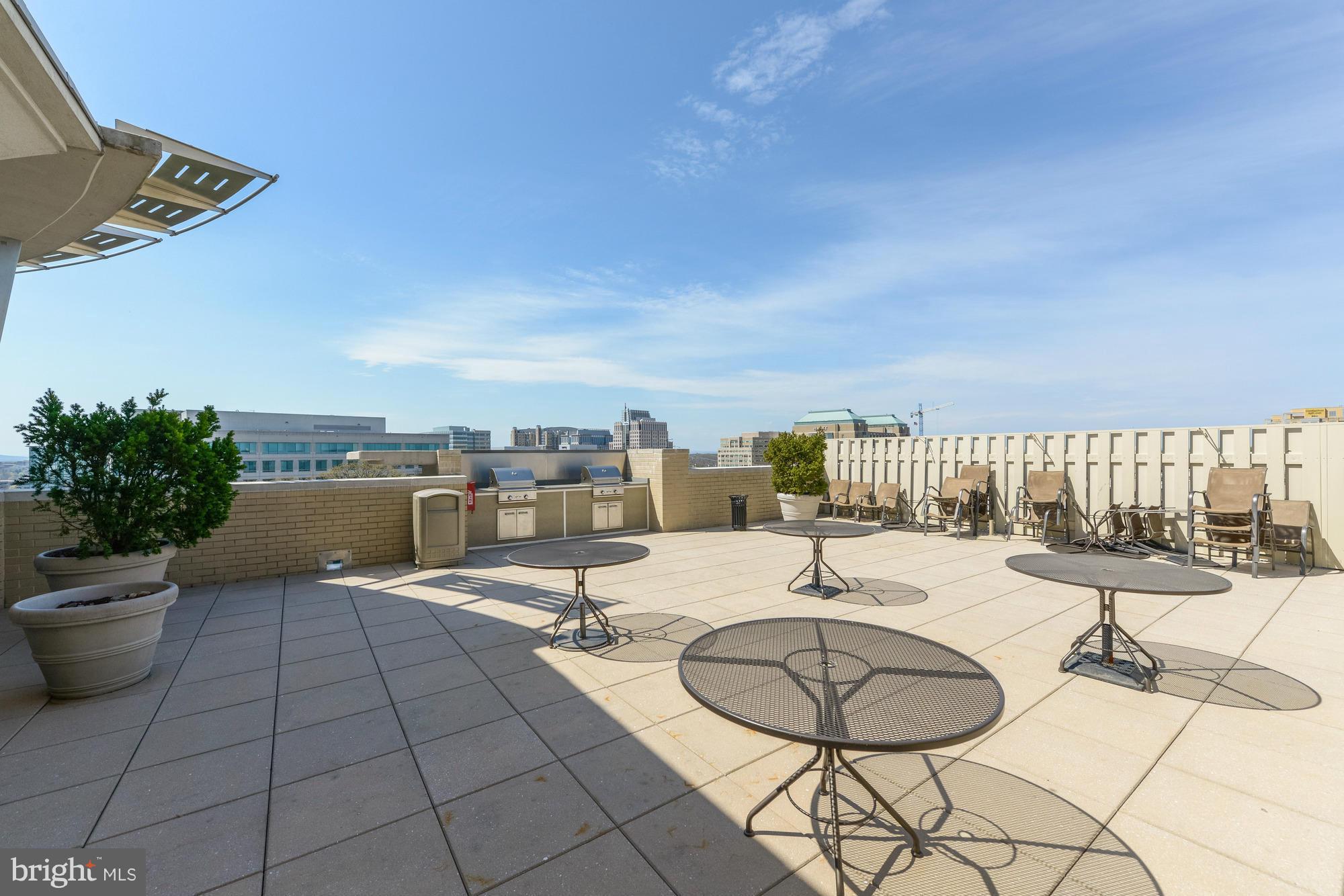 11800 Sunset Hills Road, Unit 517 Reston, VA 20190 - Photo 22 of 29 a view of a swimming pool with seating space
