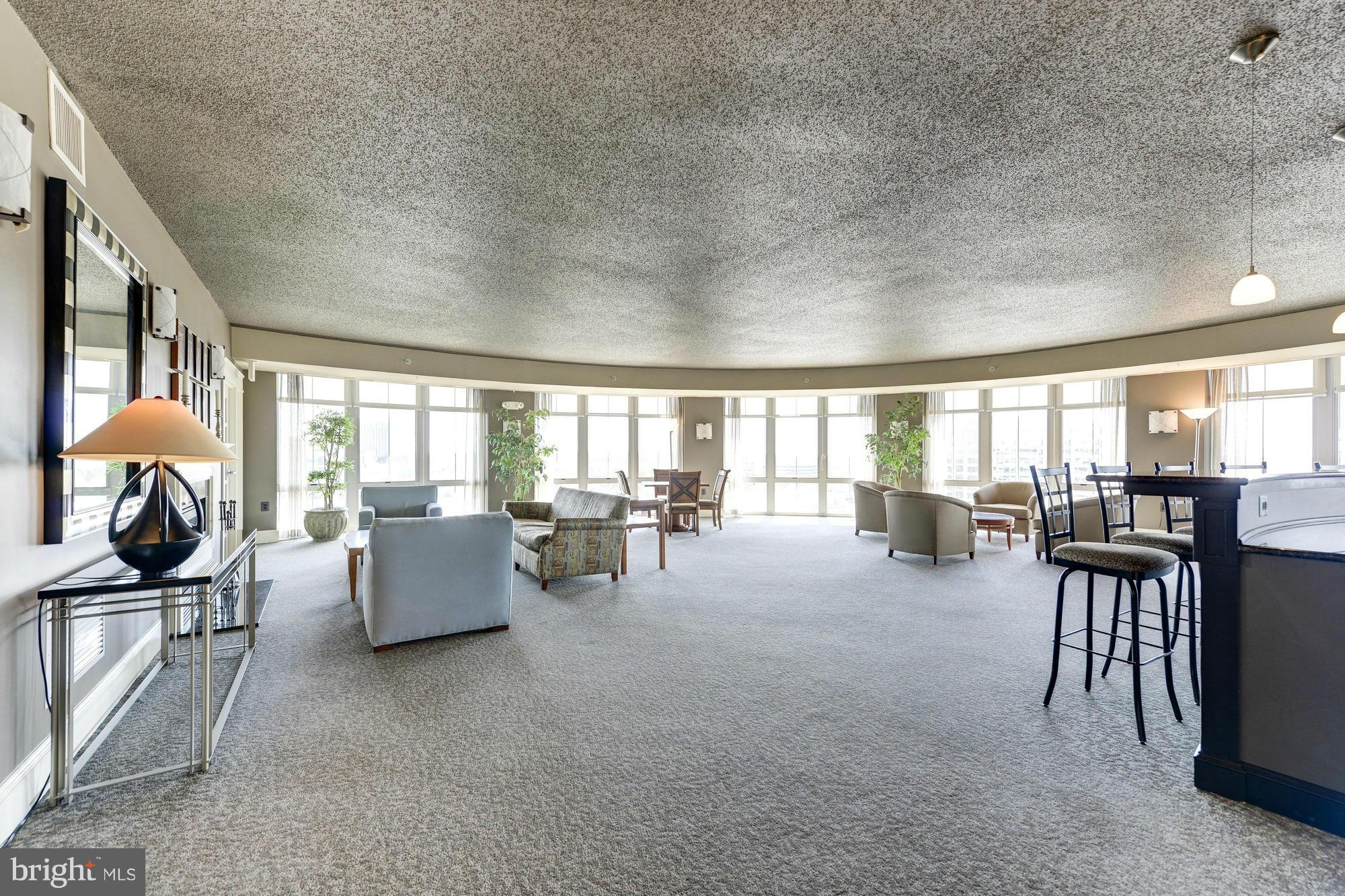 11800 Sunset Hills Road, Unit 517 Reston, VA 20190 - Photo 23 of 29 a living room with furniture and a large window