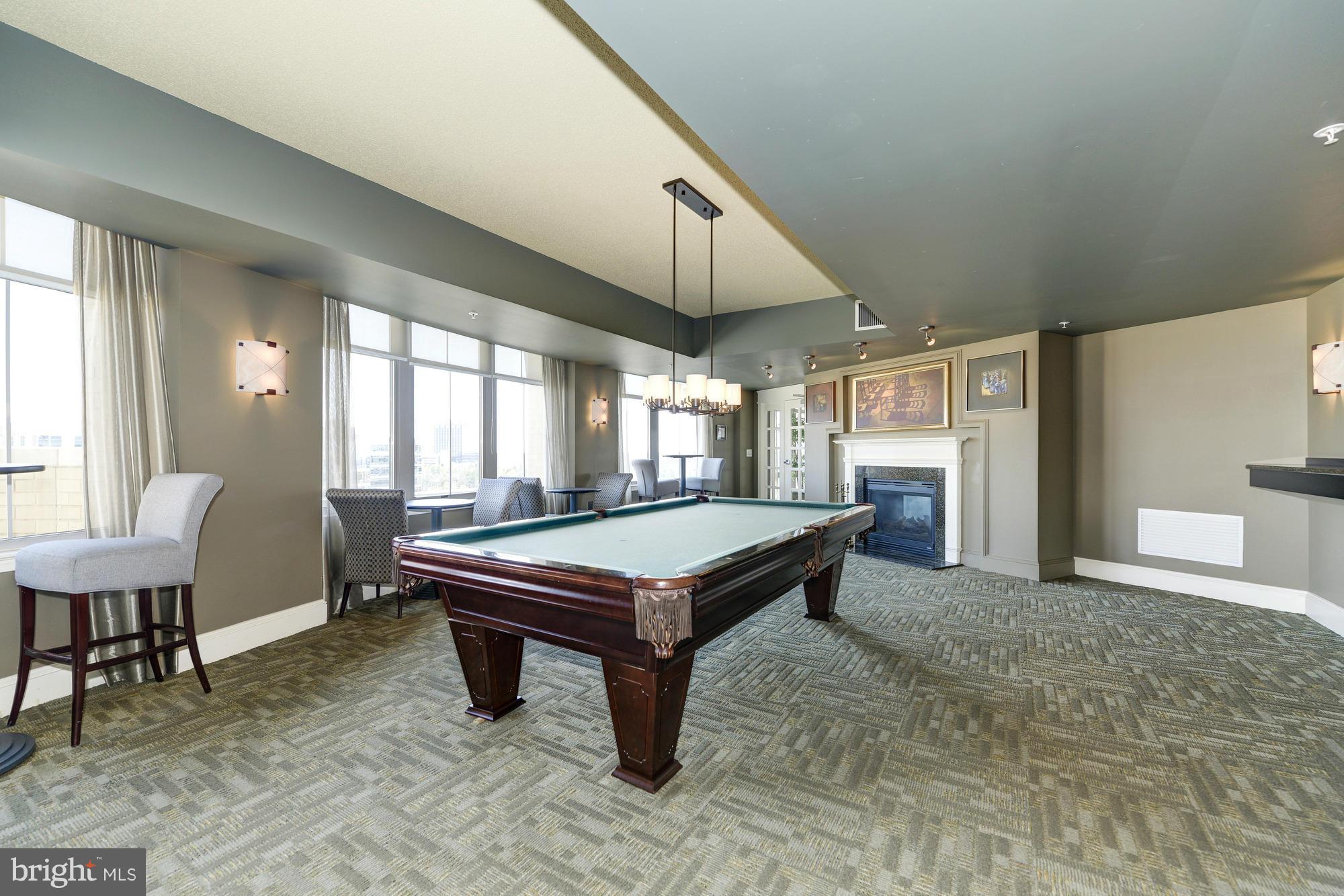 11800 Sunset Hills Road, Unit 517 Reston, VA 20190 - Photo 26 of 29 a room with pool table and windows