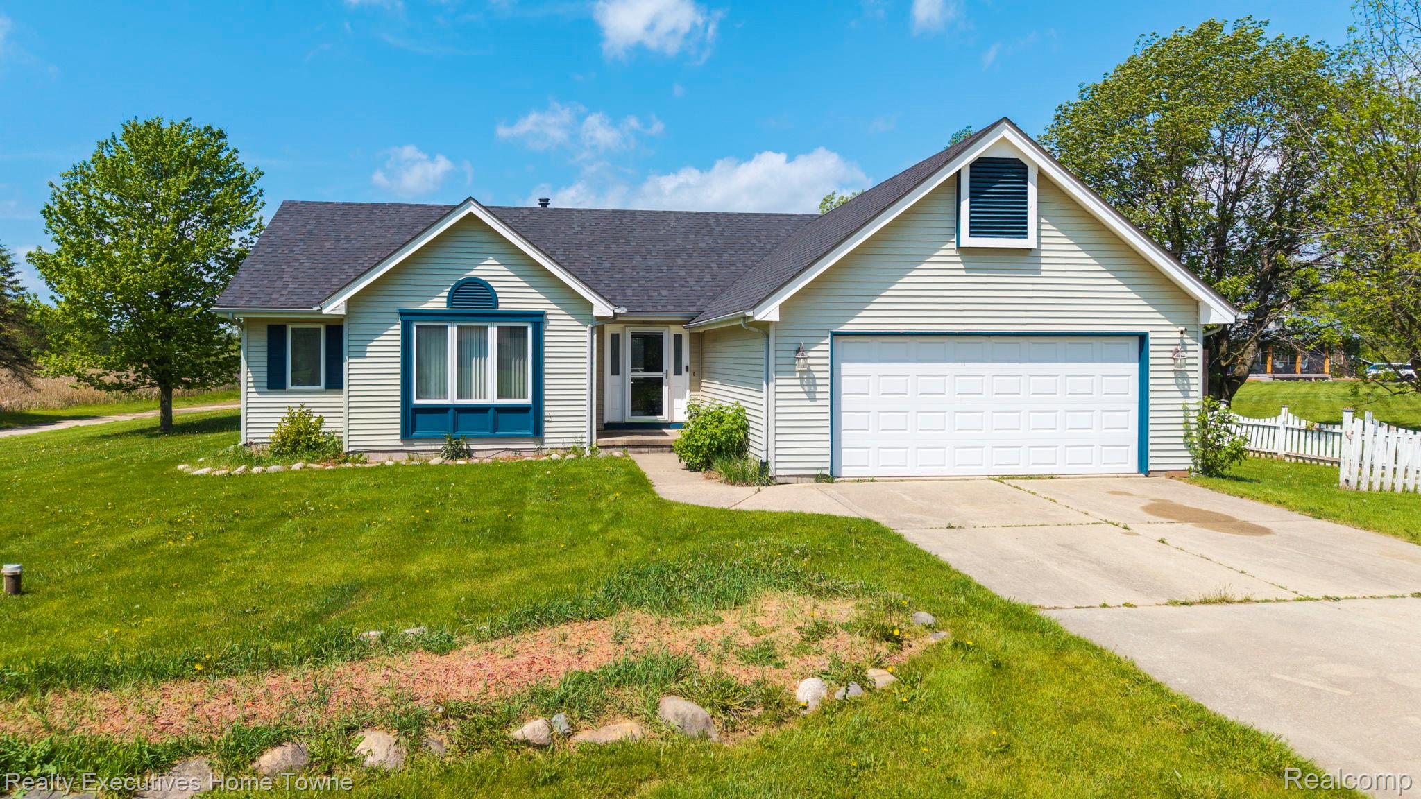 1041 Mackie Road Almont, MI 48003 - Photo 2 of 56 Single story home with driveway, a garage, and a shingled roof