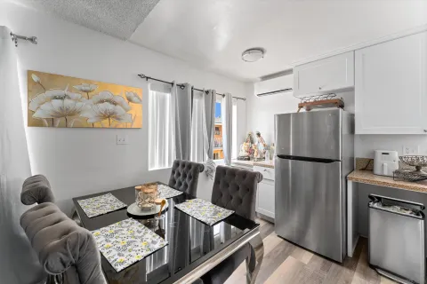 a kitchen with stainless steel appliances granite countertop a refrigerator and a stove
