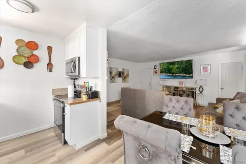 a living room with furniture and flat screen tv