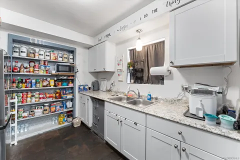 a kitchen with a sink and a cabinets