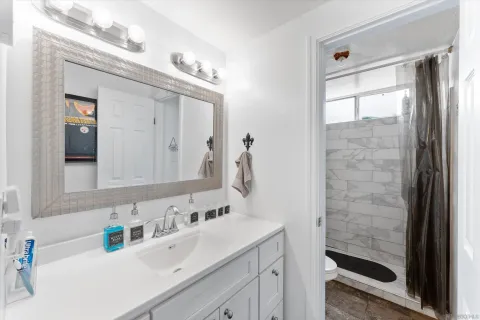 a bathroom with a sink a vanity and a mirror