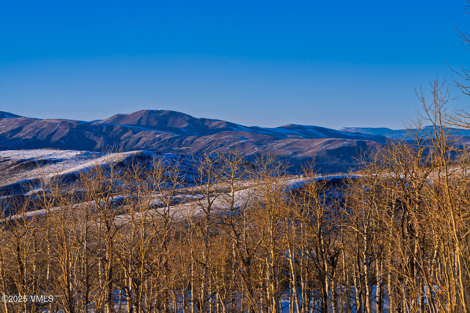 72 Martingale Lane Edwards, CO 81632 - Photo 13 of 52 a view of a large building with a mountain in the background