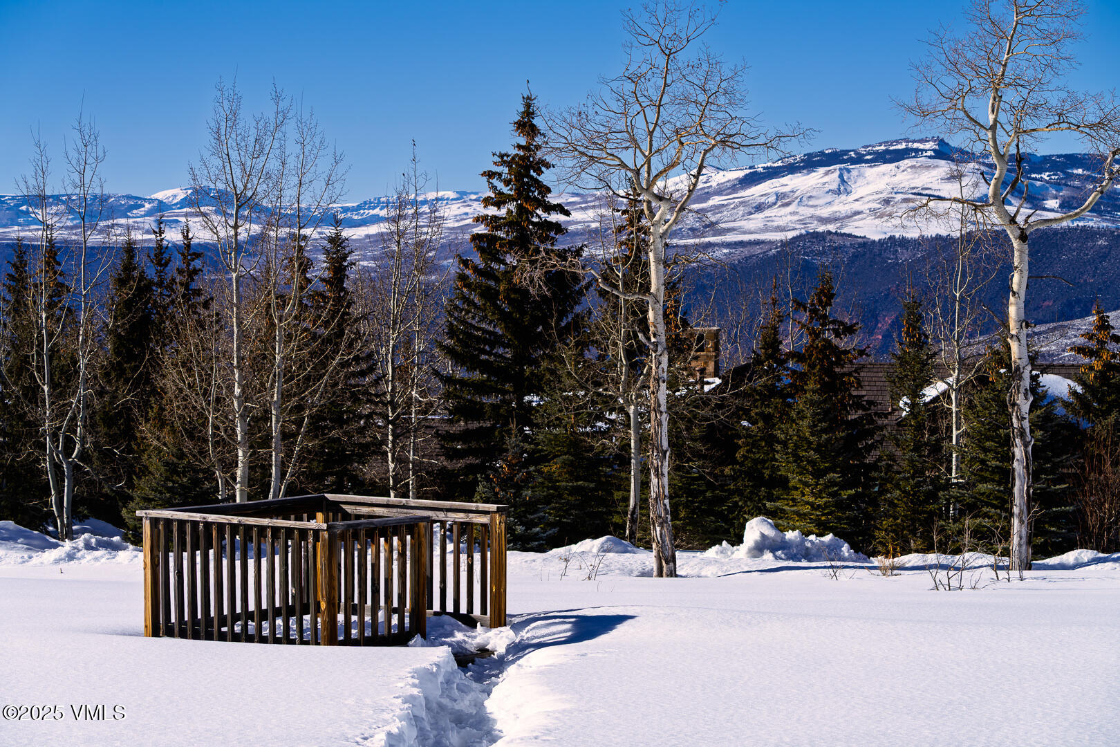 72 Martingale Lane Edwards, CO 81632 - Photo 7 of 52 a street view with wooden fence and trees