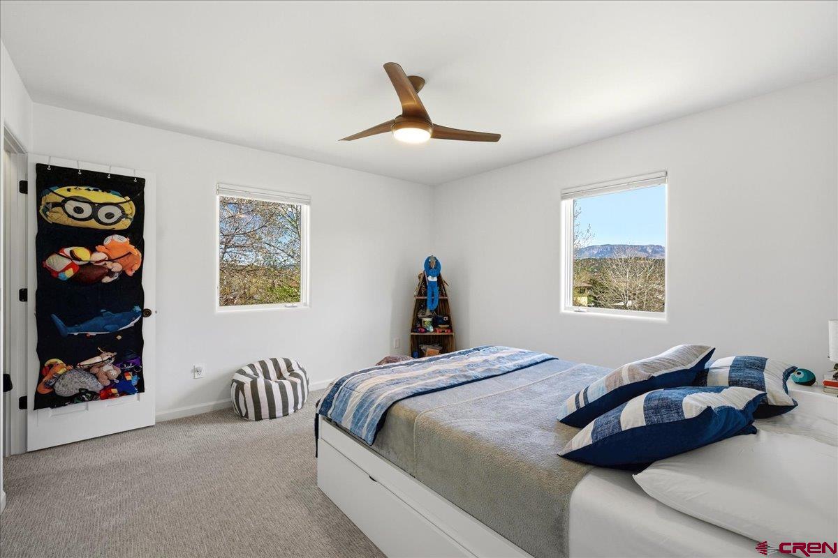320 South Amelia Street Ridgway, CO 81432 - Photo 26 of 40 a bedroom with bed and a window
