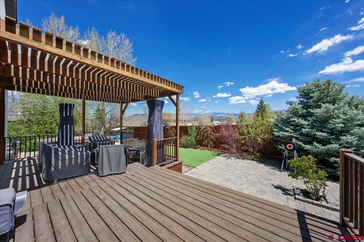 320 South Amelia Street Ridgway, CO 81432 - Photo 33 of 40 a view of a roof deck with wooden floor and fence with a potted plant