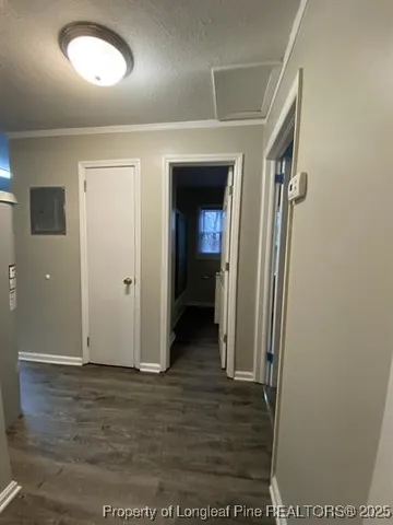 an empty room with wooden floor and closet