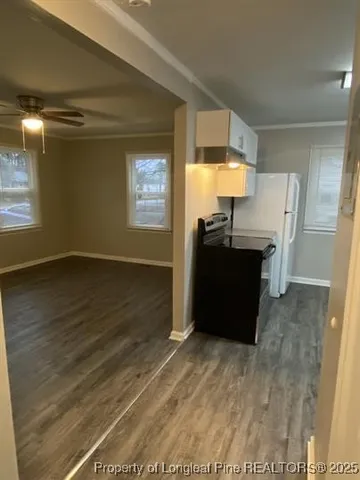 a view of a kitchen with wooden floor