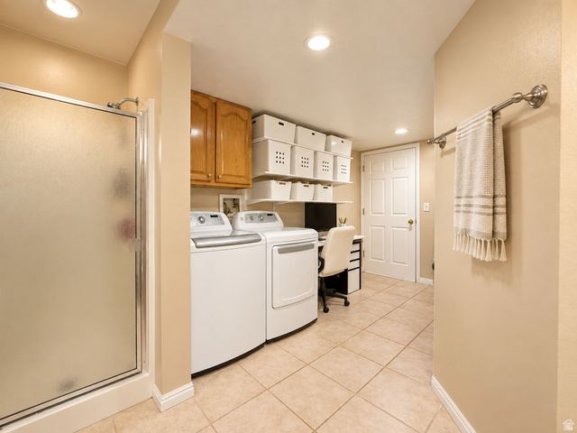 452 North 600 East Springville, UT 84663 - Photo 21 of 26 Frosted glass shower enclosure, wood-finish cabinetry, recessed lighting, and tile flooring