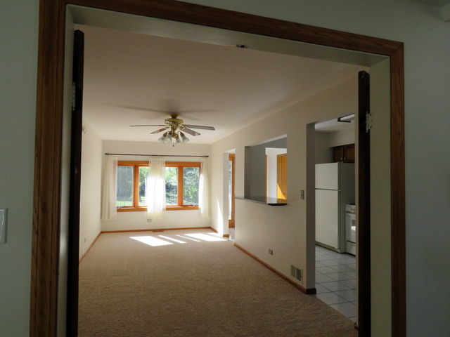 304 Ralph Court Island Lake, IL 60042 - Photo 8 of 16 a view of a windows and chandelier in a room