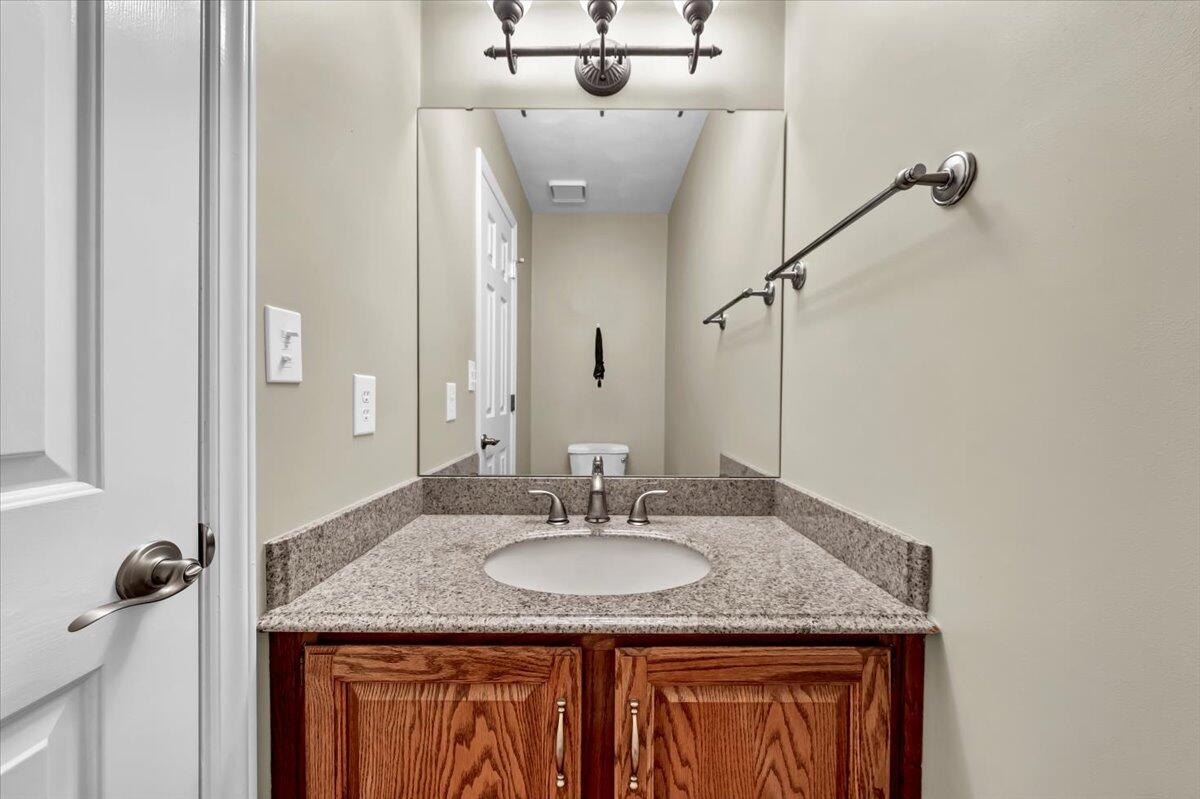 278 Stonehaven Lane Blue Ridge, VA 24064 - Photo 29 of 61 a bathroom with a granite countertop sink and a mirror