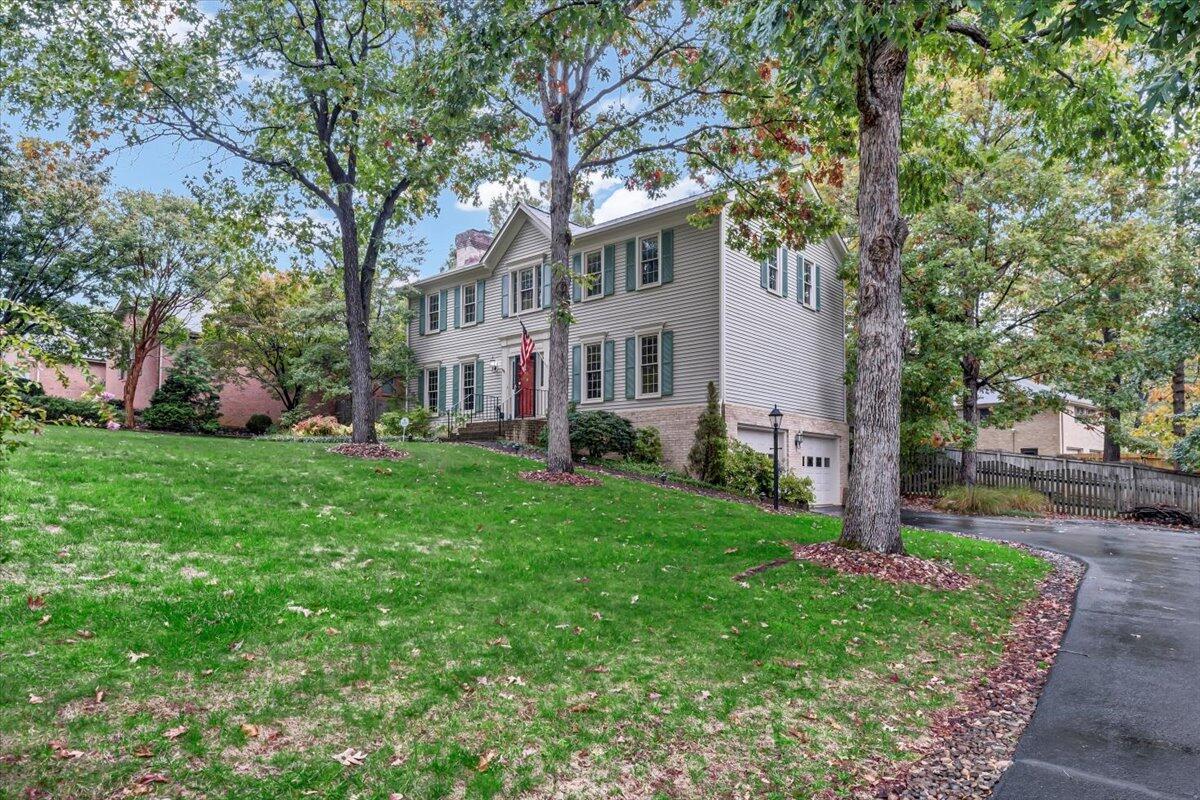 278 Stonehaven Lane Blue Ridge, VA 24064 - Photo 3 of 61 a front view of a house with a garden and trees