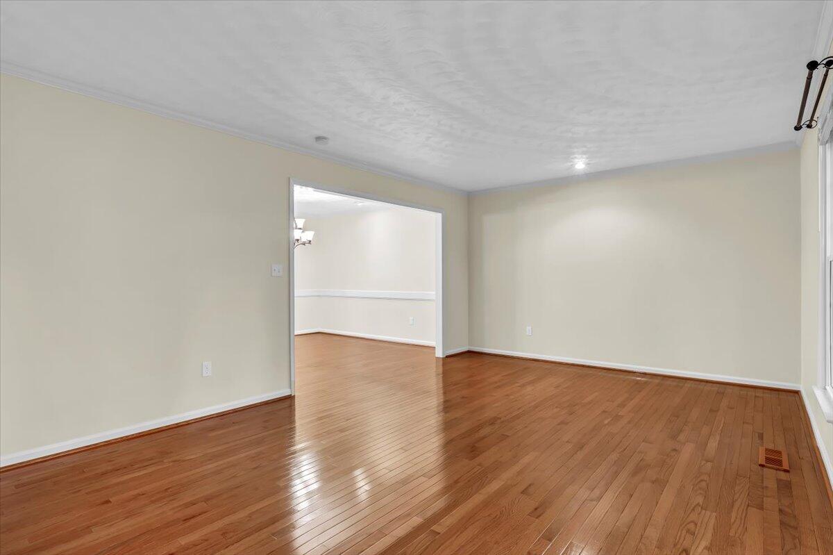 278 Stonehaven Lane Blue Ridge, VA 24064 - Photo 8 of 61 a view of an empty room with wooden floor