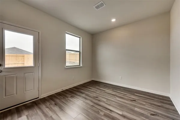 a large kitchen with stainless steel appliances granite countertop a stove a sink dishwasher a microwave oven and a refrigerator