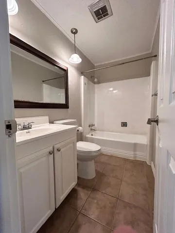 a bathroom with a double vanity sink toilet mirror and shower
