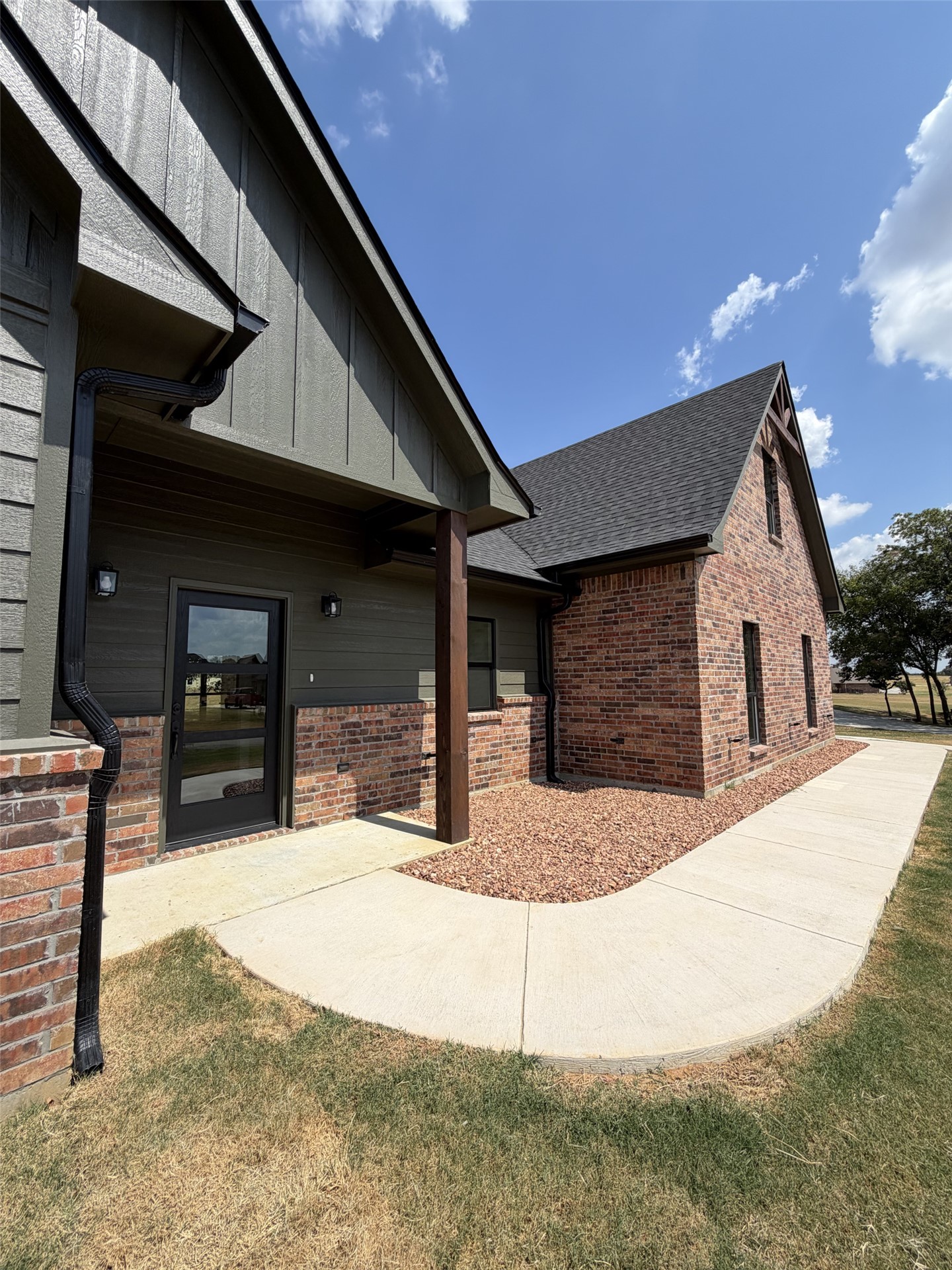33 Wilderness Road North Calera, OK 74730 - Photo 33 of 39 Brick and siding exterior with a covered entry