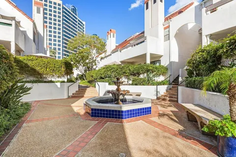 a wooden bench sitting in front of a building