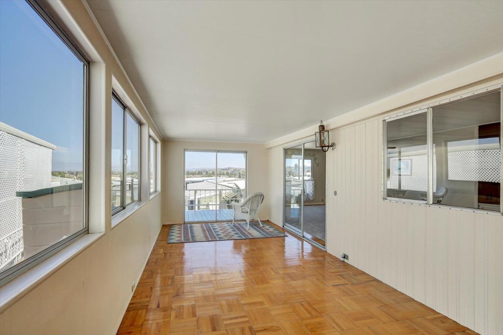 287 Robin Lane Oceanside, CA 92057 - Photo 13 of 27 a view of an entryway with wooden floor and a fireplace