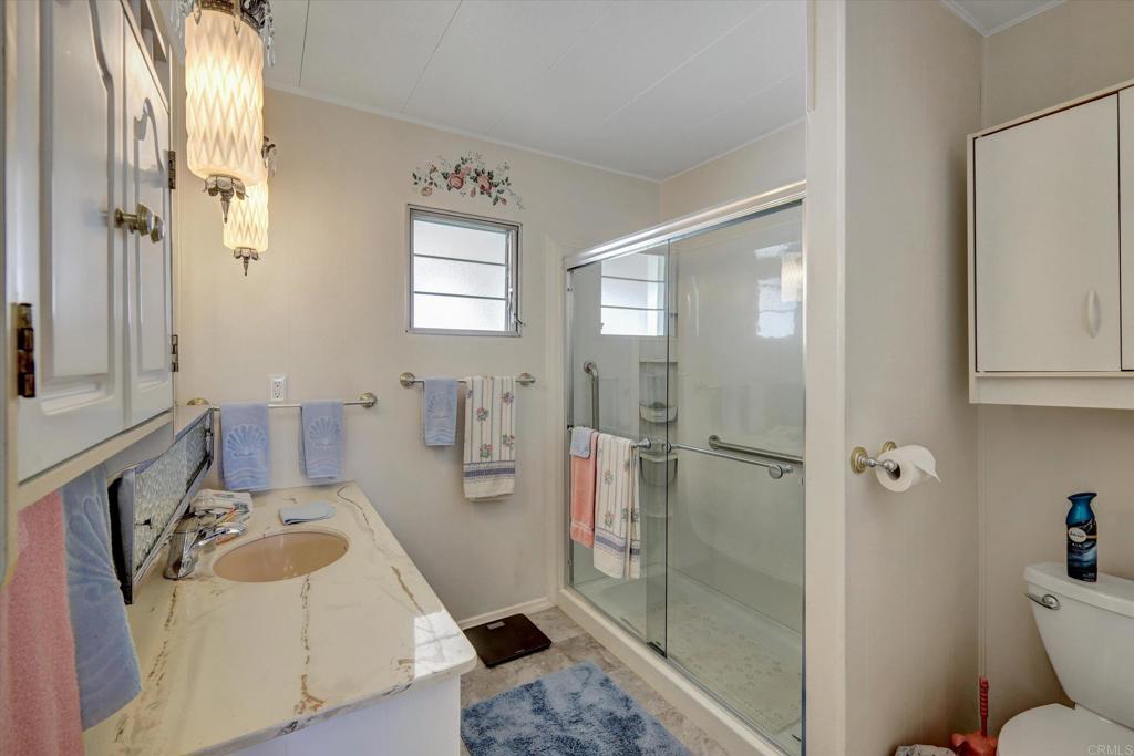 287 Robin Lane Oceanside, CA 92057 - Photo 15 of 27 a bathroom with a sink toilet and shower