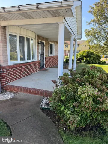 front view of a house with a garden