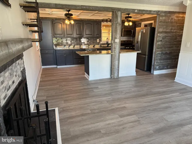 a kitchen with refrigerator and sink