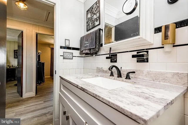 a kitchen with a sink and a refrigerator