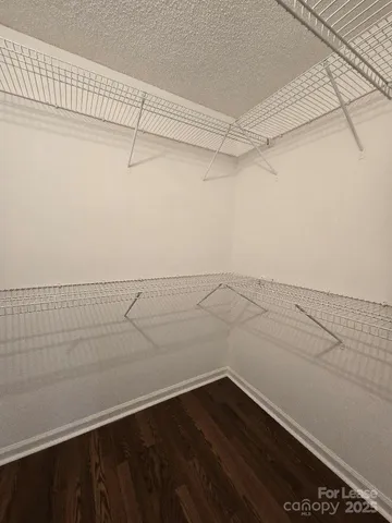 a view of a room with racks on the wall