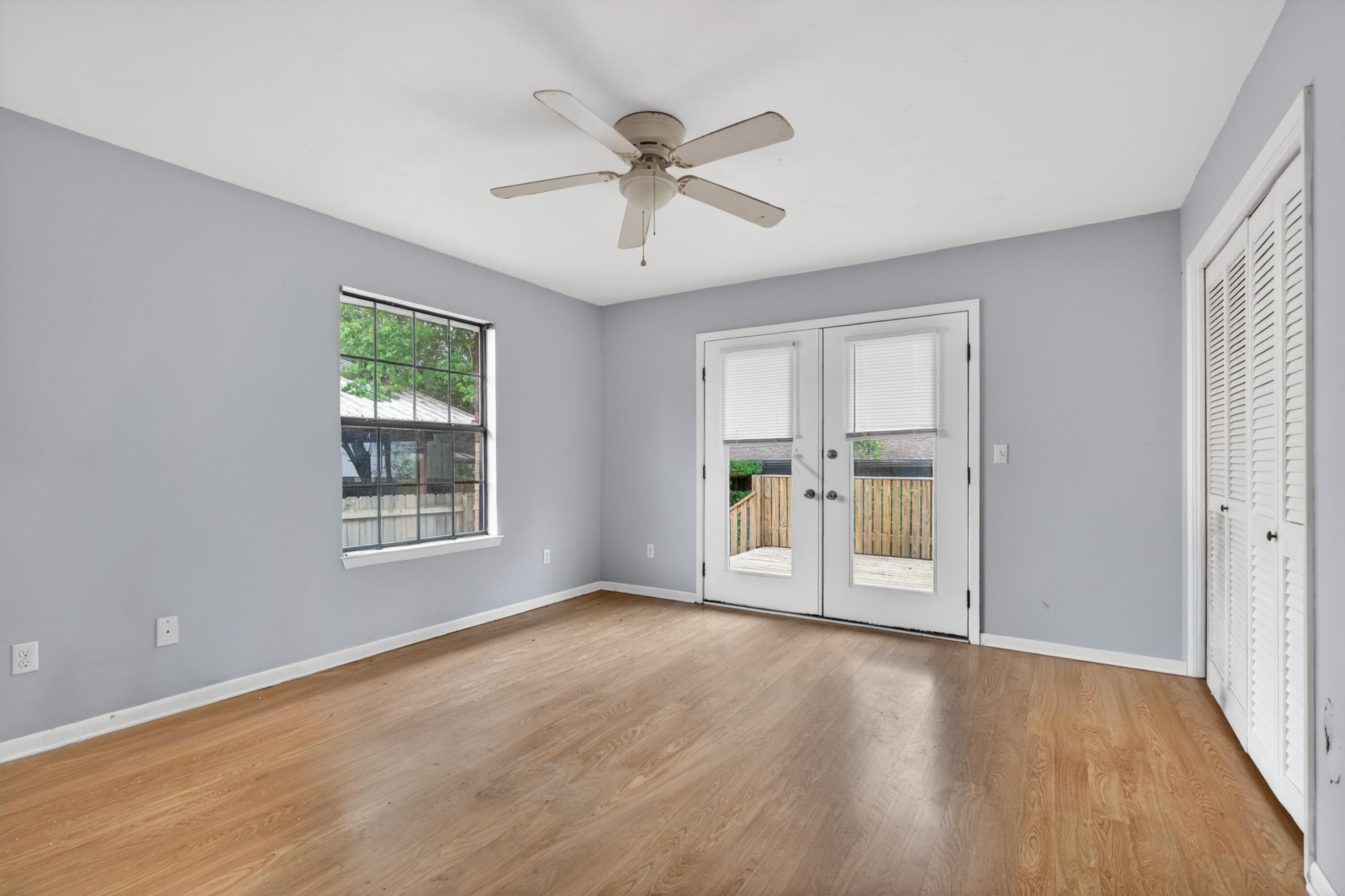 91 Catamaran Lane Shalimar, FL 32579 - Photo 12 of 24 a view of an empty room with a window and wooden floor