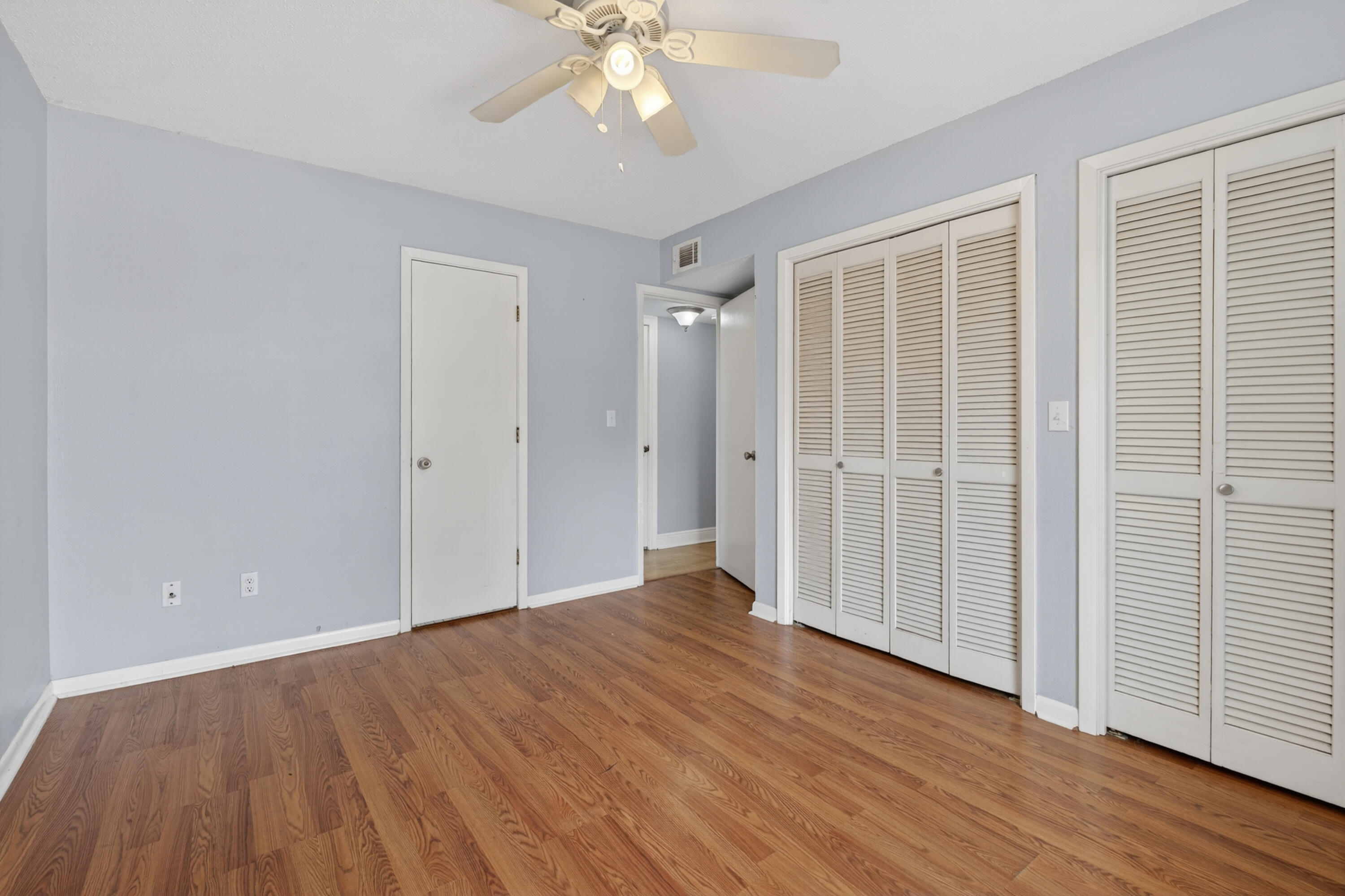 91 Catamaran Lane Shalimar, FL 32579 - Photo 15 of 24 wooden floor in an empty room with a window